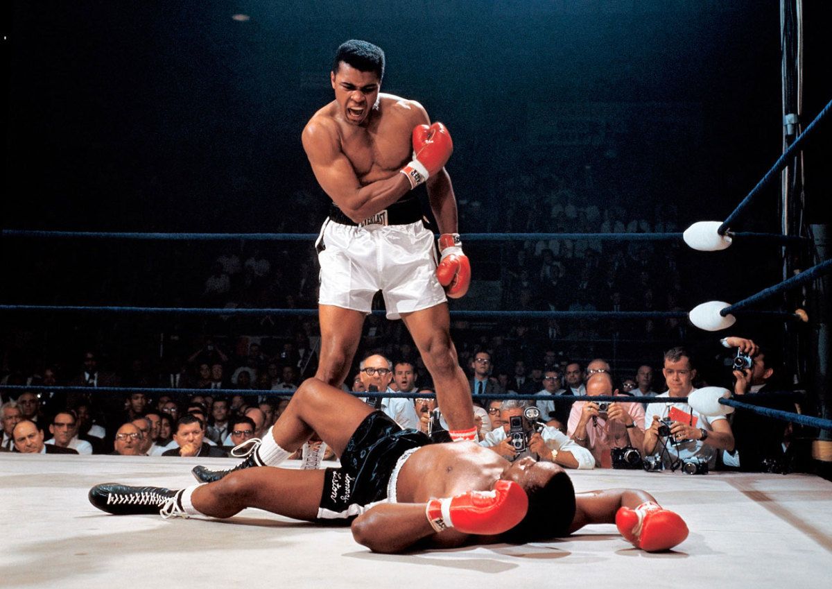 Muhammad Ali standing over Sonny Liston, photographed by Neil Leifer in 1965